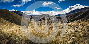 Breathtaking journey to Lindis Pass with the golden hues of the tussock-covered hills