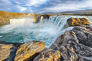 Breathtaking landscape scene of powerful Godafoss waterfall