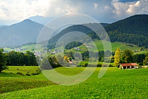 Breathtaking lansdcape of mountains, forests and small Bavarian villages in the distance. Scenic view of Bavarian Alps with majest