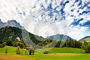 Breathtaking lansdcape of mountains, forests and small Bavarian villages in the distance. Scenic view of Bavarian Alps with majest