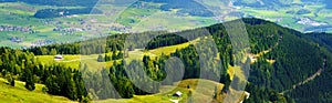 Breathtaking lansdcape of mountains, forests and small Bavarian villages in the distance. Scenic view of Bavarian Alps with majest