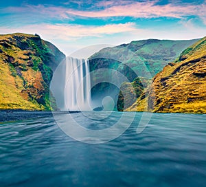 Breathtaking morning view of Skogafoss Waterfall. Fabulous summer landscape of Skoga river. Spectacular. outdoor scene of Iceland,