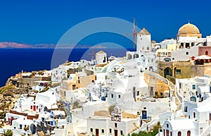 Breathtaking scenery of Oia village traditional Greek island architecture at Aegean sea background. Santorini island