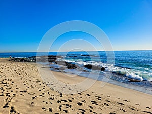 A breathtaking shot of the vast blue ocean water along the coastline with sandy beaches