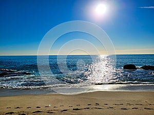 A breathtaking shot of the vast blue ocean water along the coastline with sandy beaches