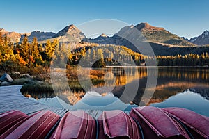 Autumn mountain lake with boat