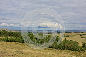 Breathtaking summer landscape Blue sky Fresh air of the Forest Field Mountains Top View