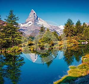 Breathtaking summer morning on the Grindjisee lake. Great view of  Matterhorn Monte Cervino, Mont Cervin peak, Swiss Alps,