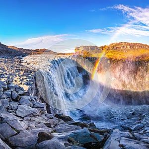 Breathtaking sunrise view of the most powerful waterfall in Europe called Dettifoss with rainbow