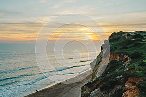 Breathtaking sunset over majestic cliffs, with a stunning ocean view