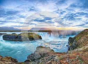 Breathtaking sunset scene of powerful Godafoss waterfall. Dramatic sky over Godafoss