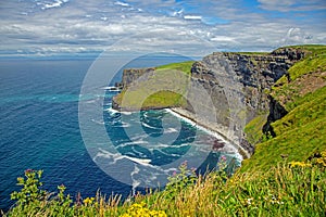 Breathtaking view of the Cliffs of Moher overlooking the Atlantic Ocean in Ireland