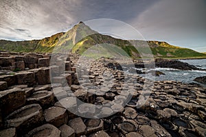 Breathtaking view of curious seaside hexagonal columnar jointing near a base of a mountain