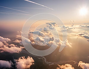 A breathtaking view of Earth from space with the sun shining through the clouds, showcasing