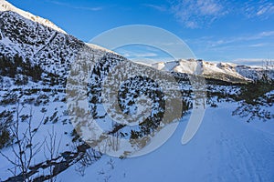 Breathtaking view of the magnificent mountains covered in snow under the blue sky in Slovakia