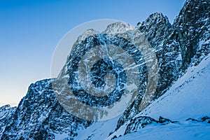 Breathtaking view of the magnificent mountains covered in snow under the blue sky in Slovakia