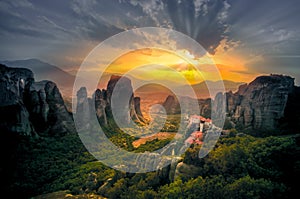 Breathtaking view of Meteora Roussanou Monastery at sunset, Greece.