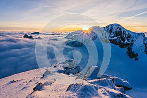 Breathtaking view of the mountains peaks covered in snow under at sunset in High Tatras Slovakia