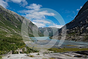 Breathtaking view over a clear blue lake Nigardsbrevatnet from the Nigardsbreen glacier in Jostedalsbreen National Park