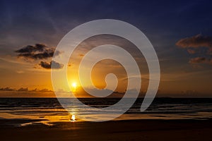 Breathtaking view of the setting sun on the beach