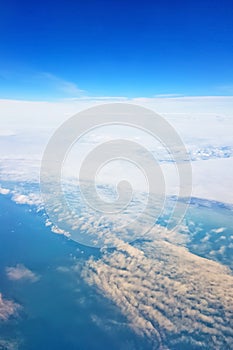 Breathtaking view of the sky and clouds from the window of a flying plane