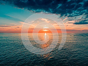 Breathtaking view of the sunset over the sea in Oosterschelde Stormsurge Barrier, Netherlands