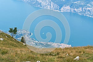 Breathtaking view from the top of Monte Baldo to the town of Malcesine and the blue Lake Garda