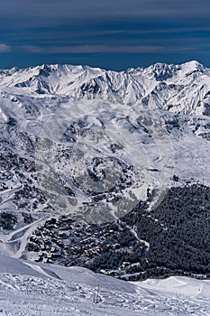 Breathtaking view from the top of the slopes to the Courchevel ski resort.