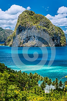 Breathtaking view of tropical coast with jungle and Pinagbuyutan Island in the blue ocean El Nido, Palawan, Philippines