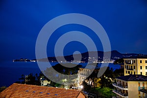 Breathtaking view from window in the night on Liguria region in Italy. Awesome villages of Zoagli, Cinque Terre and