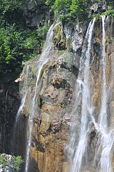 Breathtaking waterfalls panorama in Plitvice Lakes National Park, Croatia, Europe. Majestic view with turquoise water and sunset