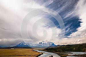 Breathtaking white cloudscape in the blue lake above Torres del Paine National Park in Chile