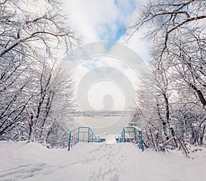 Breathtaking winter scene of city park with snow cowered trees, Ternopil, Ukraine, Europe. Impressive outdoor view of forest,