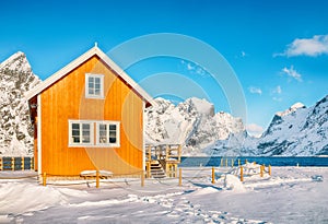 Breathtaking winter view of Sakrisoy village and snowy mountaines on background