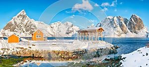 Breathtaking winter view of Sakrisoy village and snowy mountaines on background