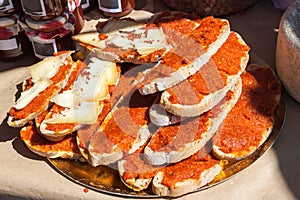 Bred with olive oil pa amb oli with sobrasada and cheese for sale in Porreres, Majorca photo