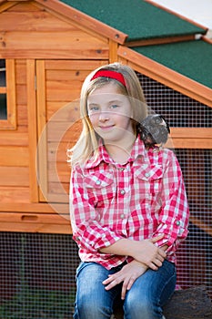 Breeder hens kid girl rancher farmer with chicks in chicken coop