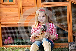 Breeder hens kid girl rancher farmer with chicks in chicken coop