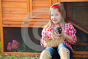 Breeder hens kid girl rancher farmer with chicks in chicken coop