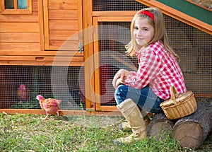 Breeder hens kid girl rancher farmer with chicks in chicken coop