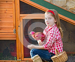 Breeder hens kid girl rancher farmer with chicks in chicken coop photo