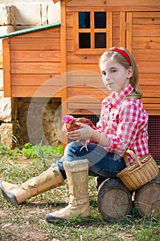 Breeder hens kid girl rancher farmer with chicks in chicken coop