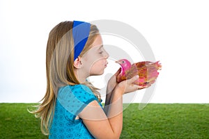 Breeder hens kid girl rancher farmer kissing a chicken chick