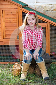 Breeder hens kid girl rancher farmer sitting in chicken tractor