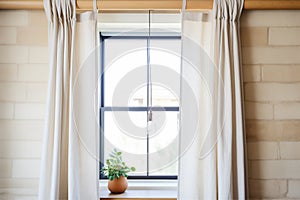 breezy linen curtains in stone window