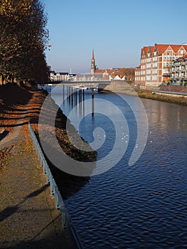 Bremen, Germany - View of the Werdersee lake and the historic brick buildings on the Teerhof peninsula towards the river Weser