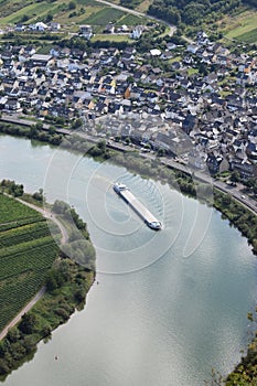 Bremm, Germany - 08 20 2020: view from Calmont to Bremm at the Mosel with a passing ship