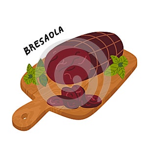 Bresaola. Meat delicatessen on a wooden cutting board.