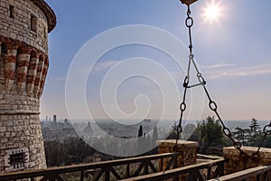 From Brescia castle heights, the view stretches over the old town, with the Duomo dome against the backdrop of modern architecture