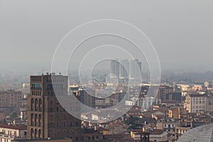 Brescia cityscape, buildings in fog, Lombardy, Italy